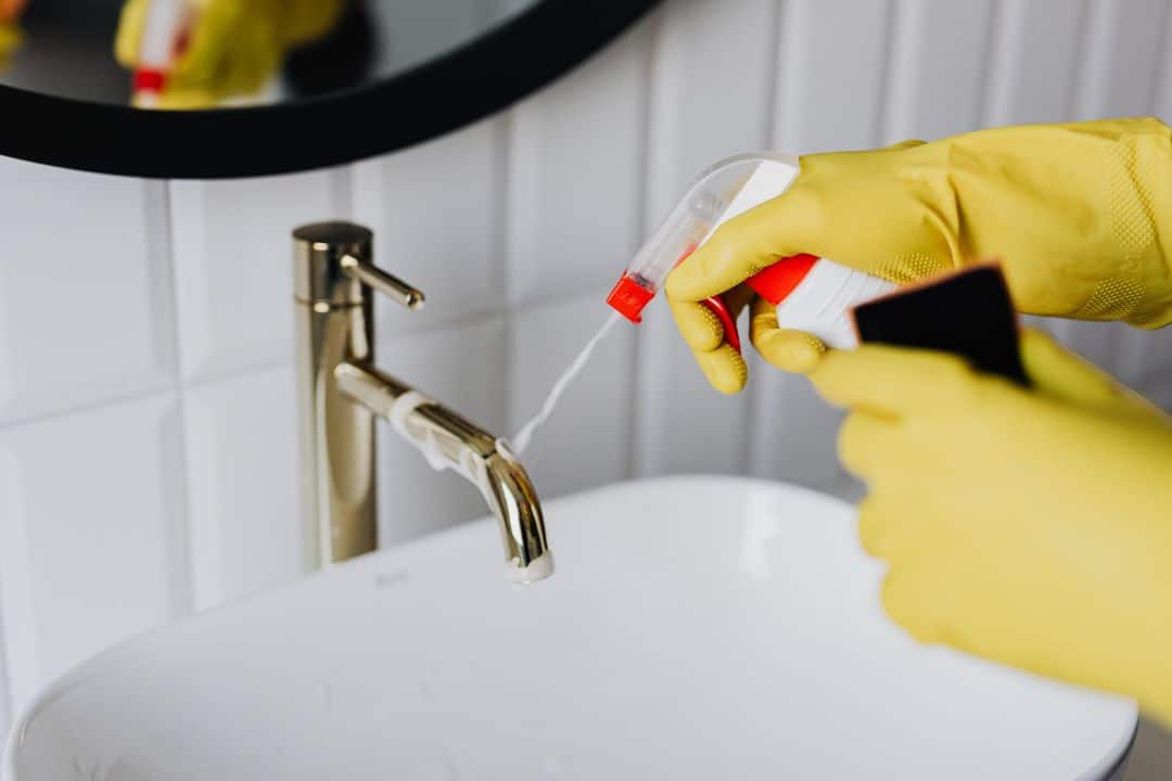 Professional cleaner from Shine This wiping kitchen counters in a Portland Oregon home