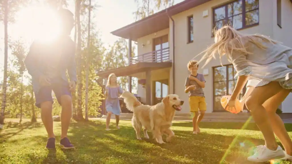Family enjoying time with their dog at home with residential cleaning services.